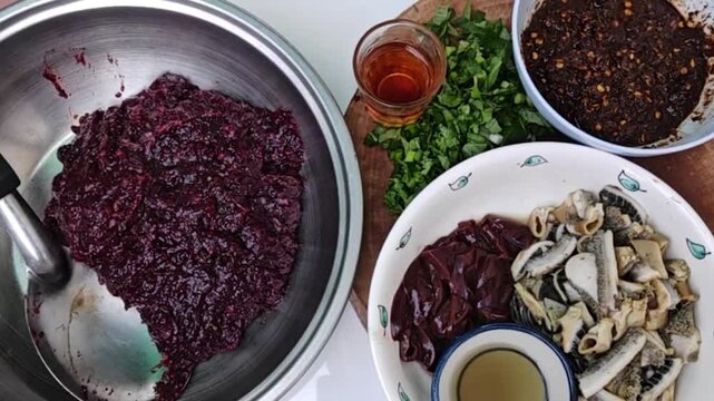 The focus is on selecting raw minced pork, slicing and preparing it on a wooden cutting board to make traditional Northern Thai-style larb.