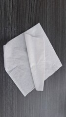 Obraz premium White Folded Tissue Paper on Dark Background