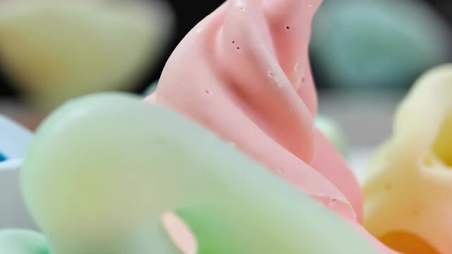 Abstract wax sculptures, flowing organic shapes, soft pastel colors, matte finish.