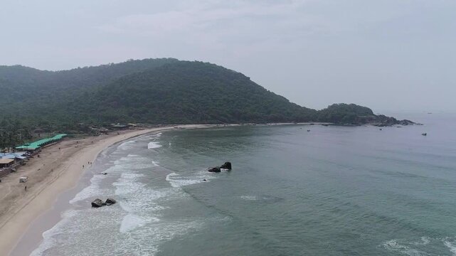 Morning aerial drone view of Agonda Beach coastline with soft sunlight in South Goa, India