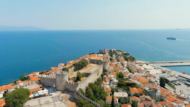 Kavala, Greece. Kavala Fortress. The ferry leaves the port. Historic city center. Summer. Drone footage