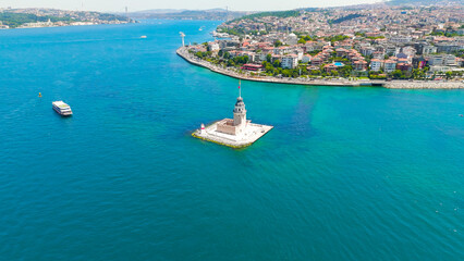 Istanbul, Turkey. Historic Maiden Tower Kiz Kulesi legendary landmark on islet in Bosphorus Strait with water taxis on sunny day. Aerial View © Video Render