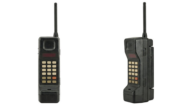 Vintage brick mobile phone from the 1980s isolated on white background, retro cellular technology and 80s communication history.
