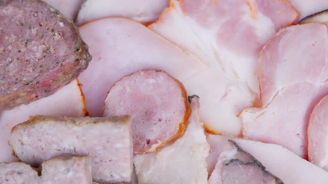 Artfully layered savory meats showcased with professional illumination. Expertly curated selection of smoked cured meats displayed under bright studio lighting with crisp textures