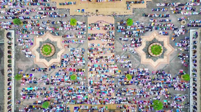 a view of the moslem congregation is praying Eid. Prayers outside the islamic centre mosque samarinda.