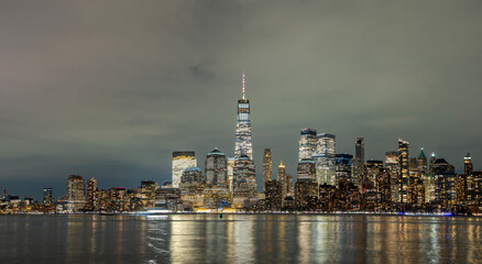 Obraz premium New York skyline night cityscape. New York city night view. New York glowing skyline night. New York Manhattan night.
