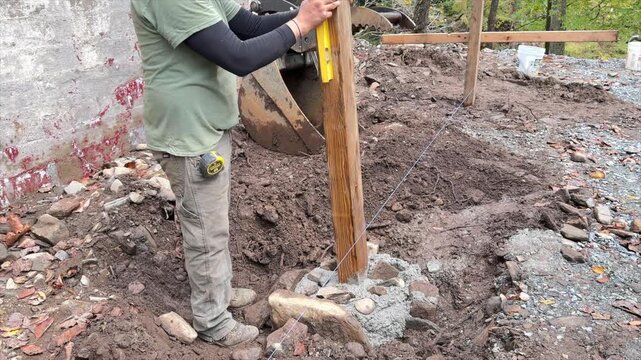 Back filling and tamping a post hole