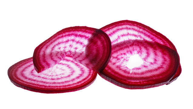 Vibrant red and white Chioggia beet slices with concentric rings, isolated on transparent background