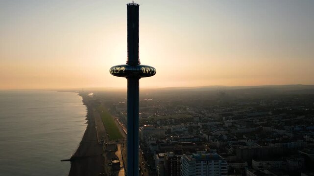 Close Up of Brighton i360 Tower at Sunset with Beach and City Silhouettes in Brighton UK