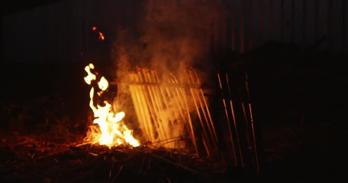 Khao lam preparation and fire cooking process in thailand outdoor food experience night scene
