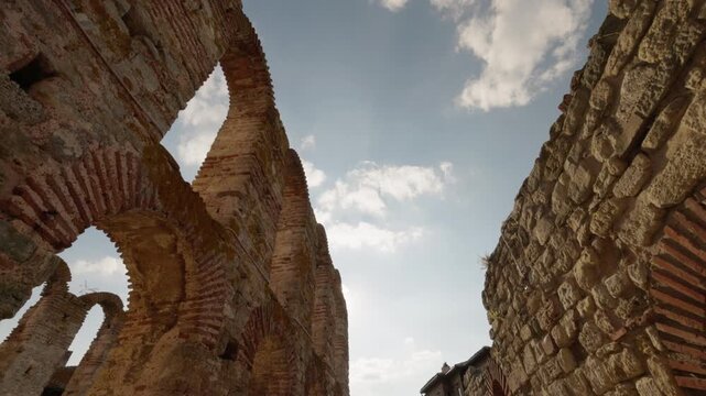 Ancient ruined church arches with sunlight and sky in Nessebar Bulgaria medieval stone architecture