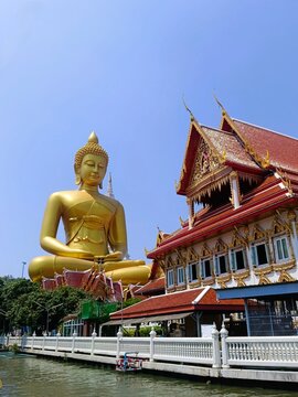 Giant buddha statues in Bangkok at wat paknam phasi charoen canal tour Thailand