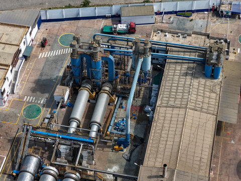 Aerial view of a cement factory, with kilns and preheating towers