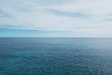 Fototapeta premium View of the ocean with blue tones and a smooth water texture