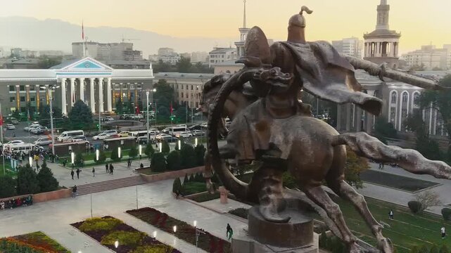 Sunset video of Bishkek, city capital of Kyrgyzstan in Central Asia with government building and Kyrgyz people enjoying the warm weather.
