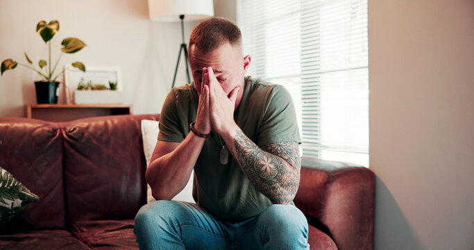 Therapy, office and man with anxiety for session, ptsd and thinking of trauma on sofa or psychology. Counseling, appointment and person with depression, mental health and patient with bad memories