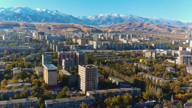 Beautiful Central Asia panoramic aerial video of Trans-Ili Alatau mountains and Bishkek, capital of Kyrgyzstan, view.

