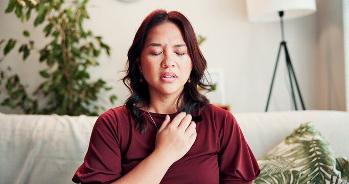 Breathe, therapy and woman on sofa for holistic healing, mindfulness and calm for counseling. Psychology, somatic therapist and person with breathwork for awareness, emotion regulation or eft tapping