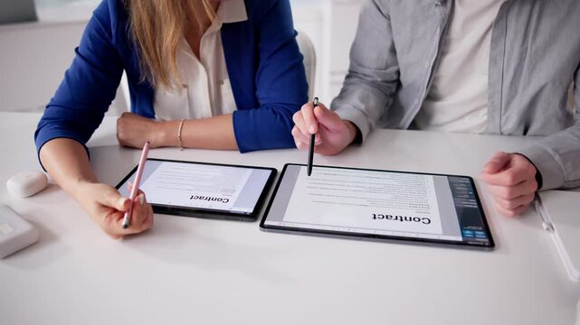 Lawyer Carefully Reviews Contract Documents, Explaining Details