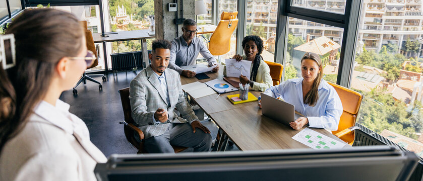 Creative team examines prototype with sketches and feedback discussions