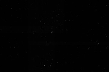 Obraz premium Subtle Dark Dust Grain Overlay Texture on Black Background with Minimal Film Noise Effect.