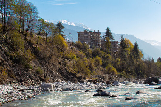 Riverside Serenity: The Beas River and Snow-Capped Himalayan Peaks in Manali
