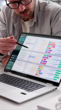 Medical Scientist Studies Data On Computer