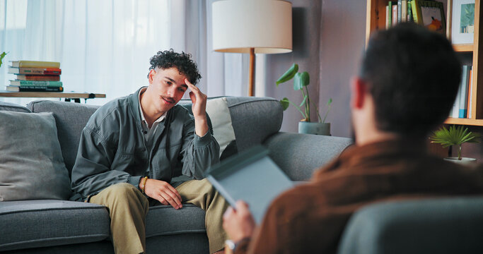 Talking, counseling and man with psychologist in office for advice, help or life coaching session. Mental health, consulting and therapist with patient for emotional support, wellness or conversation