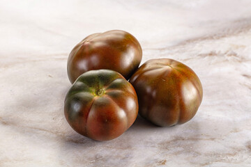 Obraz premium Ripe black juicy tomato cumato