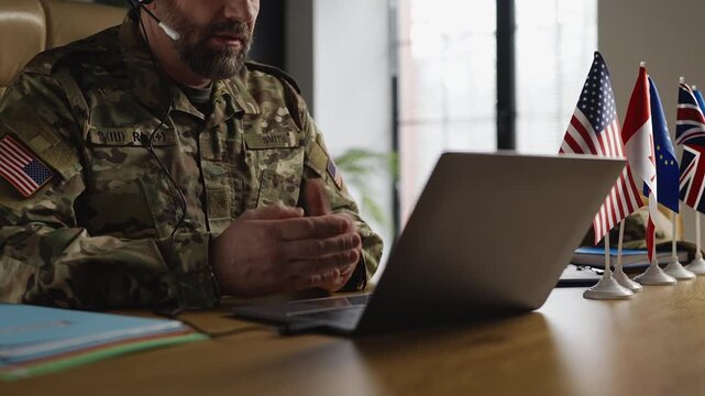 U.S. army officer talks with partners via video call, international relations