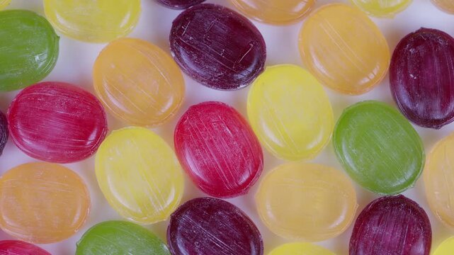 Highresolution multicolored sweet treats. Highdefinition image showcasing assortment of vibrant candies sprinkled with shimmering crystals for marketing purposes