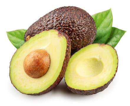 Hass avocado fruits and halved avocado with leaves isolated on white background.