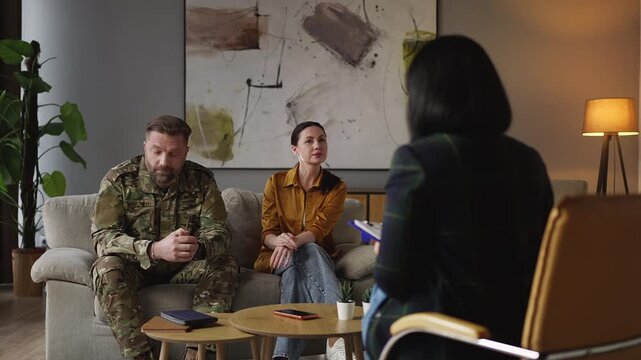 Angry military man complaining about his wife to psychologist, couple's therapy