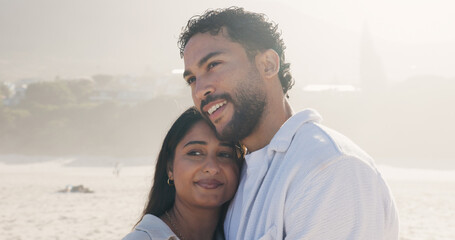 Hug, love and thinking with couple on beach together for anniversary, date or honeymoon in summer. Holiday, smile and vacation with happy people embracing outdoor for bonding, security or travel