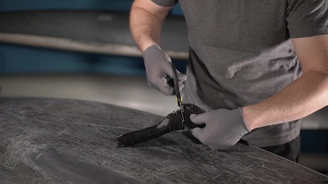 Boat repair. Use scissors. Carbon fiber. High quality 4k footage