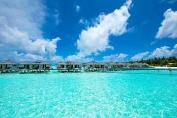 Fototapeta premium Maldives water bungalow on ocean water landscape.
