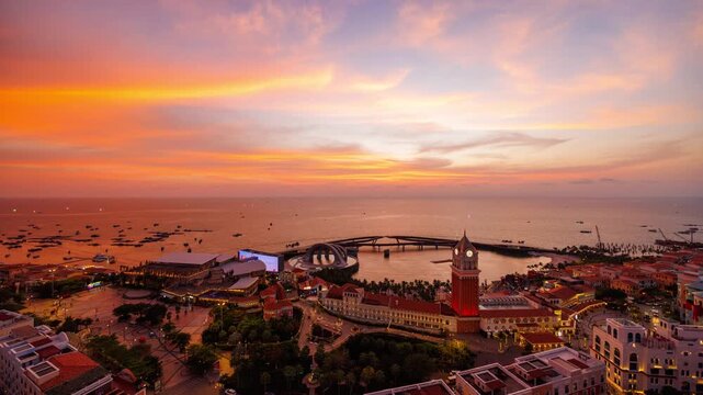 Golden sunset timelapse filmed from a rooftop in Sunset Town, Phu Quoc, Vietnam, capturing glowing sky, sea horizon, city lights, and evening atmosphere.