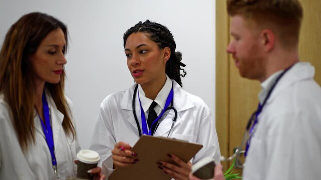 Team of doctors discussing patient case in hospital