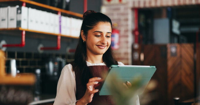 Planning, happy and woman on tablet in restaurant for online inventory, website and orders. Small business, hospitality and person on tech for digital menu, stock checklist and work schedule in cafe