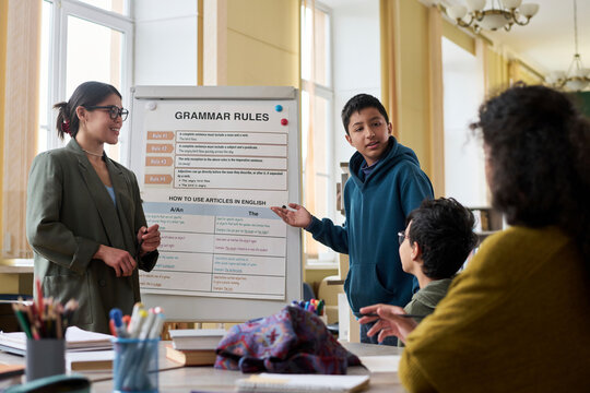 Boy speaking to group during English language class presentation