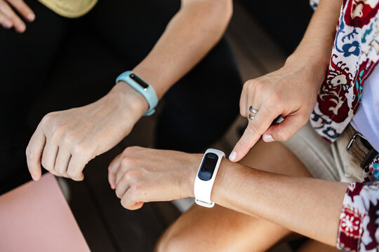 Hands using fitness trackers outdoors in Heidelberg