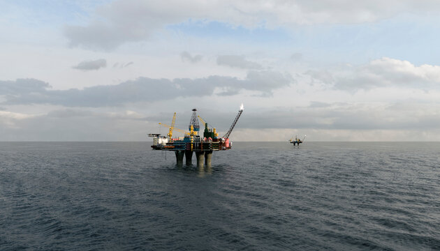 Offshore oil platform on the ocean horizon with copy space