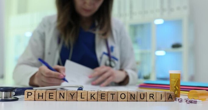 Wooden blocks spell word Phenylketonuria near pill bottle and folders. Doctor woman writes report checking newborn screening notes carefully