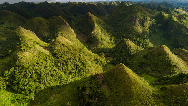 Cinematic aerial drone shot of the unique jagged rock formations and green hills of Osme&ntilde;a Peak in Cebu, Philippines