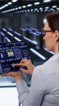 Data Technician Checks Secure Servers Carefully