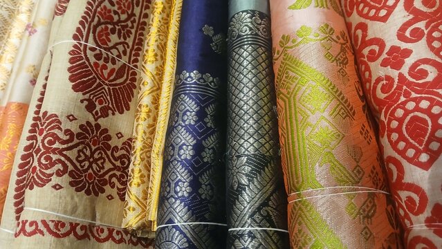 Traditional Assamese Mekhela Chador, handwoven Silk Fabric with Ethnic Motifs.