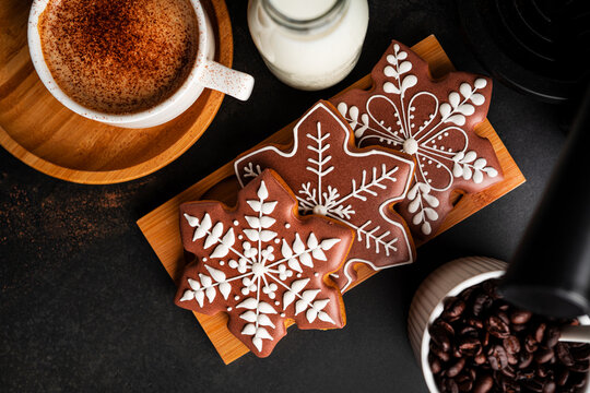 Gingerbread cookies on a dark background. Cristmas cookies with coffee. High quality photo