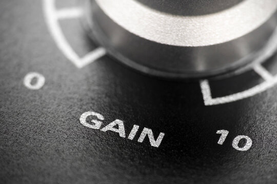 Macro shot with selective focus of volume encoder knob on audio interface