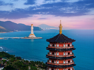 Obraz premium Buddhism pagoda and Guanyin statue in Buddha cultural park temple in Sanya, Hainan island China, aerial view