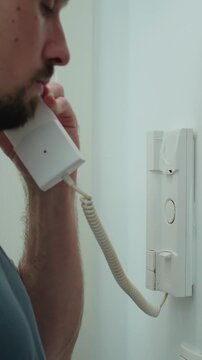 Answering the intercom and pushing the button